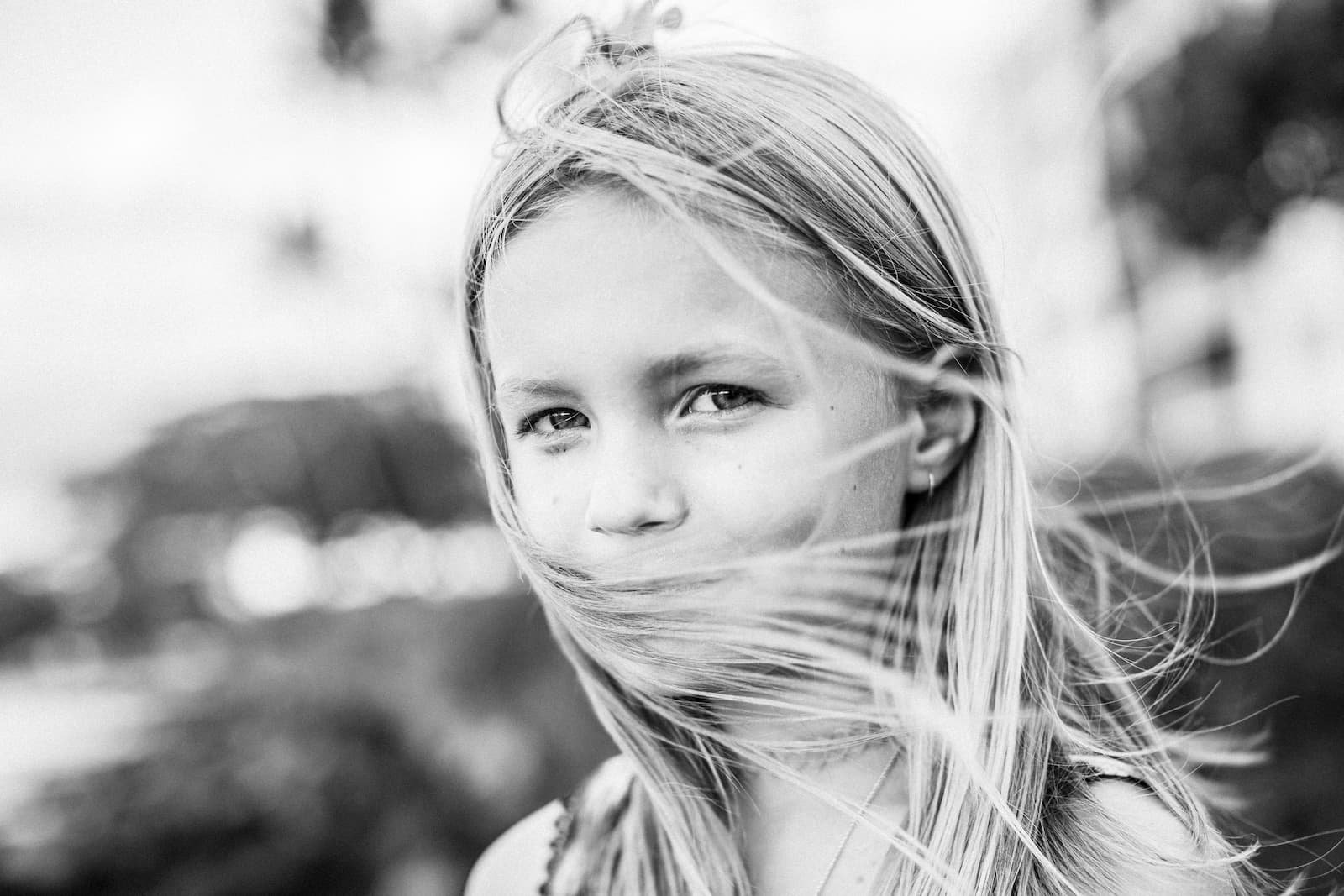 Candid black-and-white portrait of a child