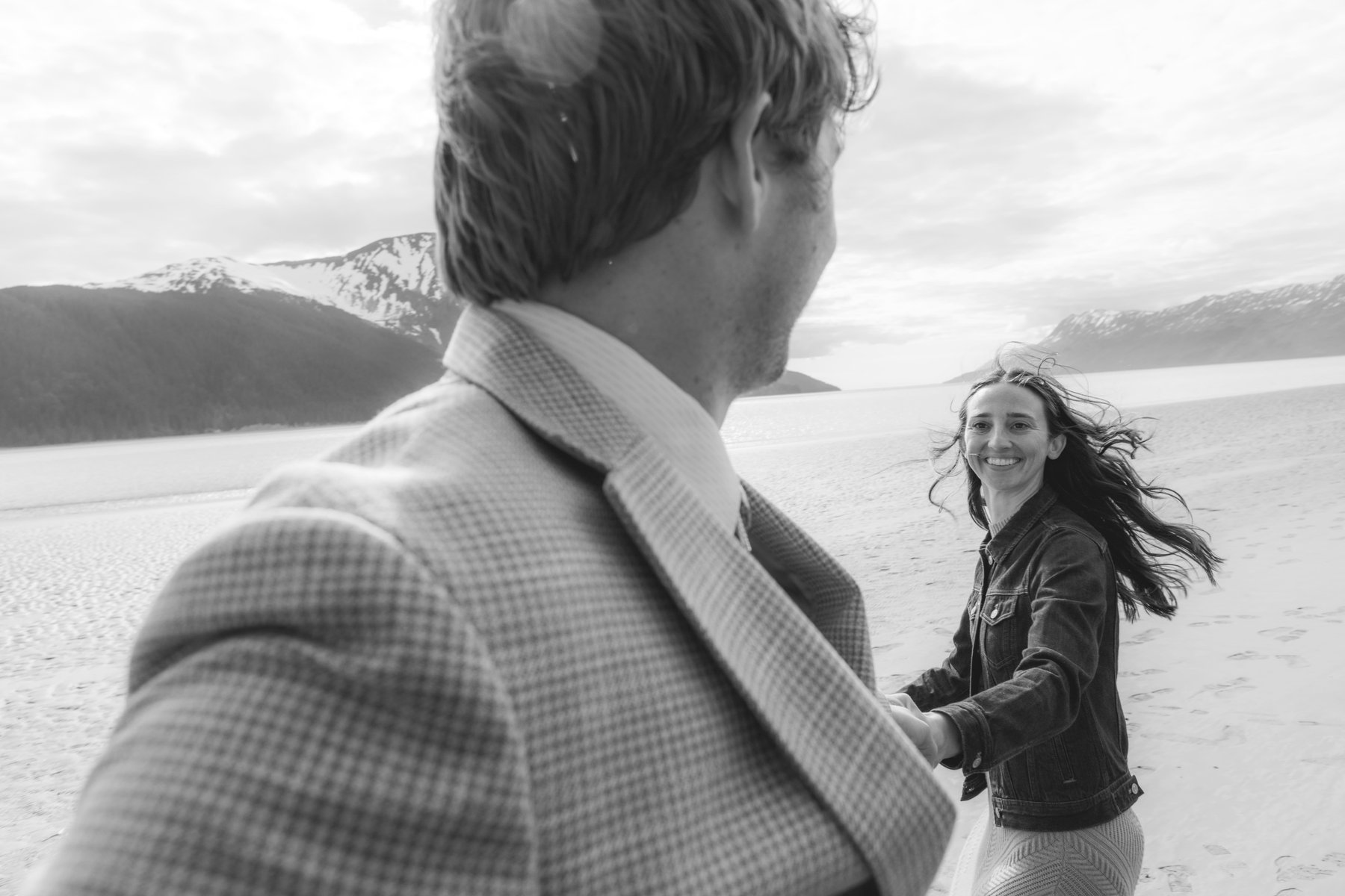 Couple laughing together, mid-moment