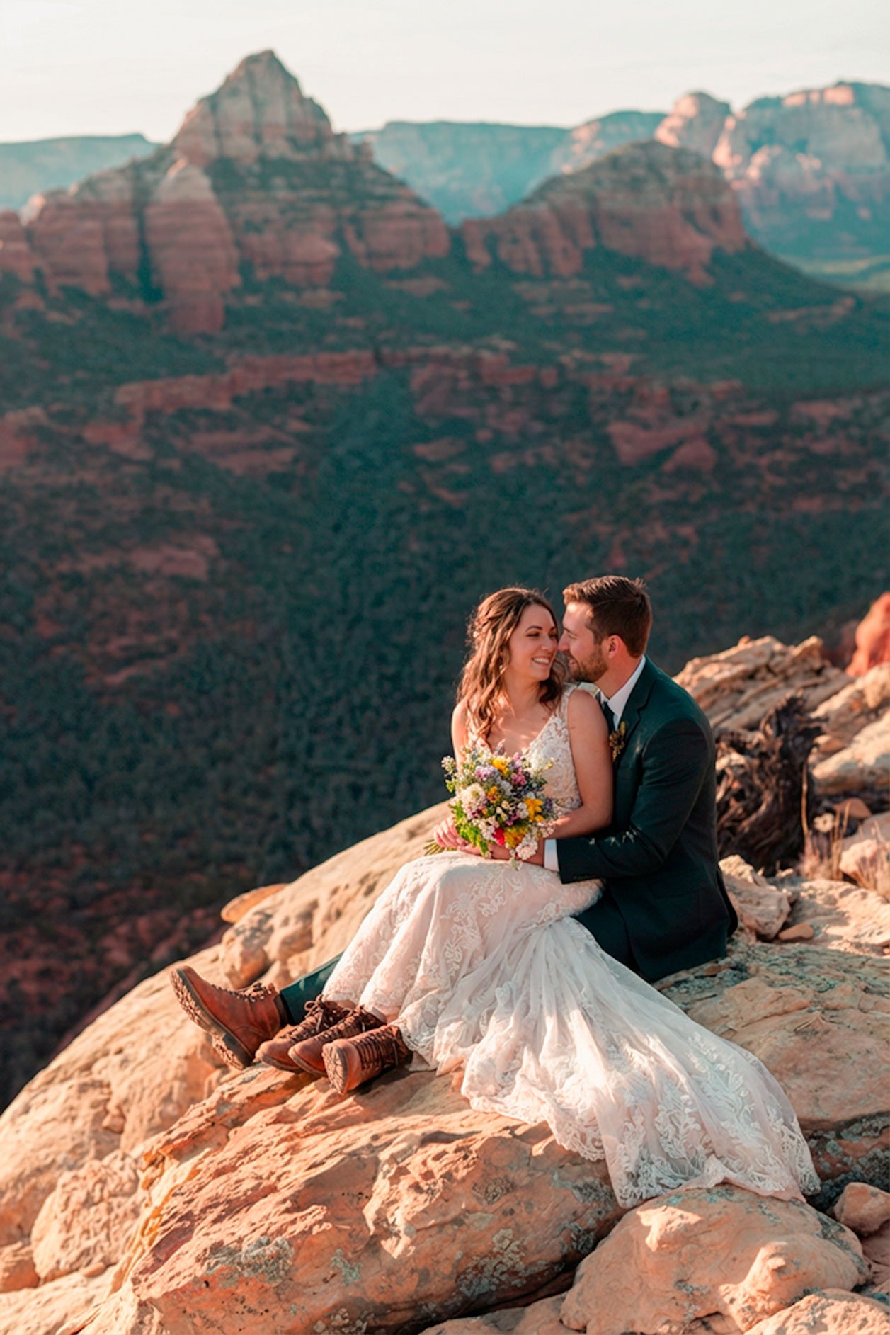 Couple embracing on red rock overlook, Sedona